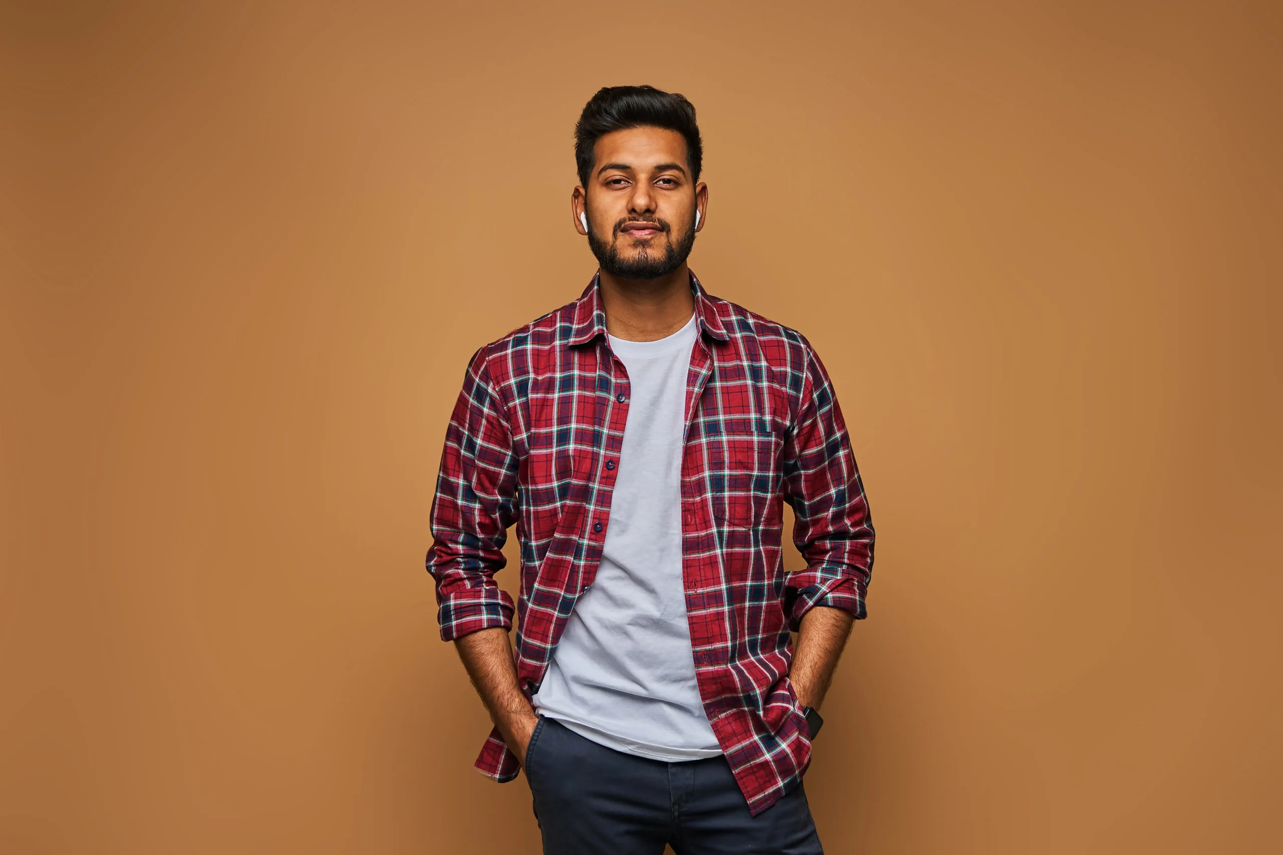 stylish handsome indian man tshirt pastel wall min scaled | Get best deals on your new packaging in Ghaziabad | We offer customised packing Solutions